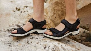 Ecco Offroad walking sandals on a rocky beach