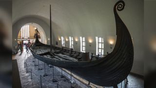 A general view of the Oseberg Ship at the Viking Ship museum, Oslo, Norway on September 10, 2017. The museum is most famous for the completely whole Oseberg Ship, excavated from the largest known ship burial in the world. The Oseberg Ship was built in southwestern Norway around the year 820 and is made of oak. In 834, the ship was used as a burial ship for two powerful women.