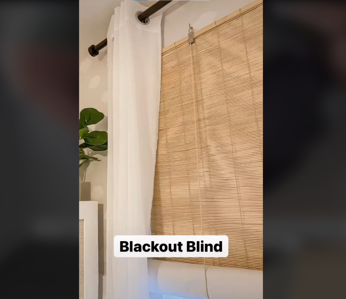 DIY bamboo blackout blinds installed into a bedroom to cover the window