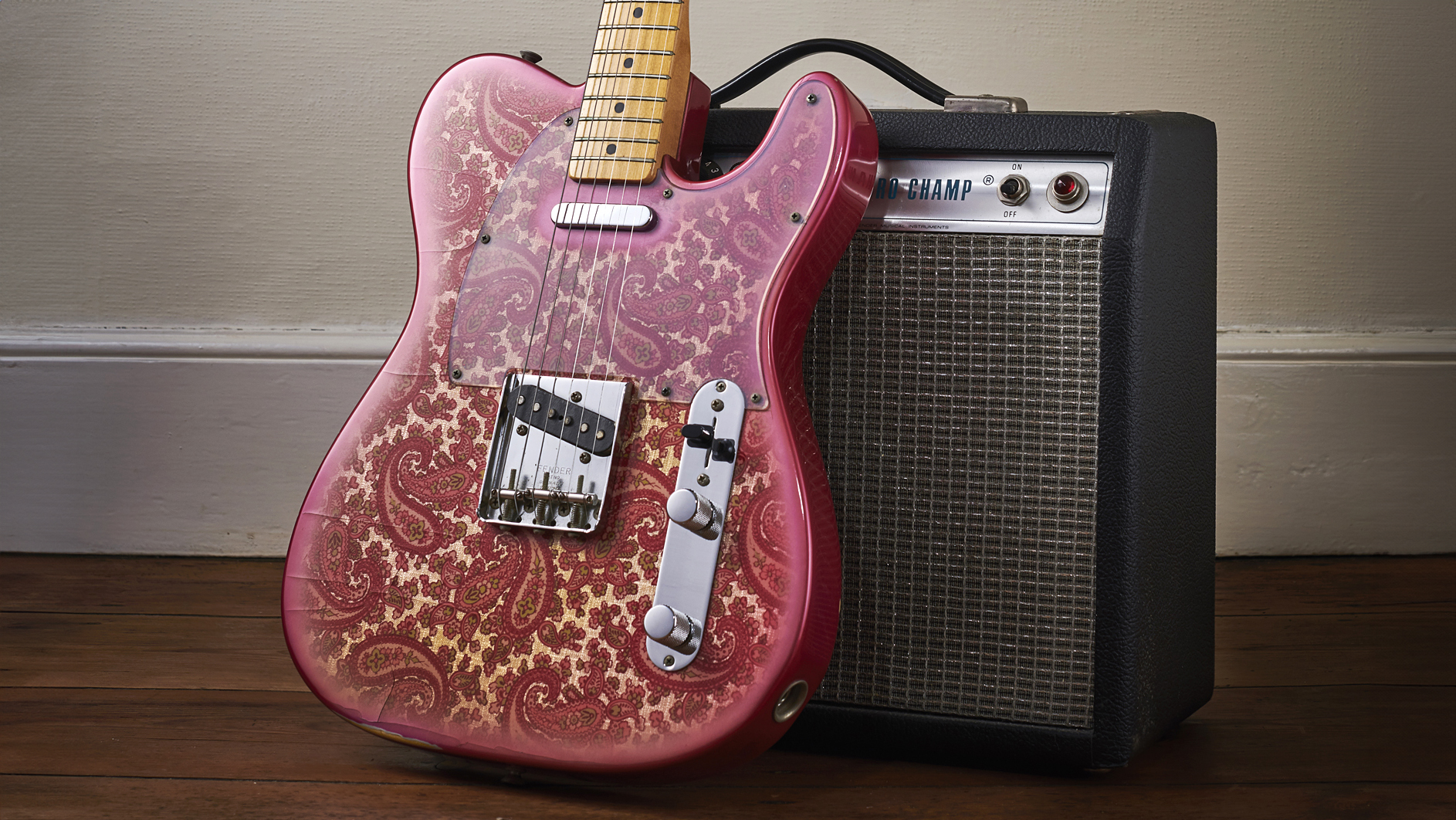 A vintage 1968 Fender Paisley Red Telecaster electric guitar and a Fender Silverface Champ amplifier, taken on March 12, 2019.