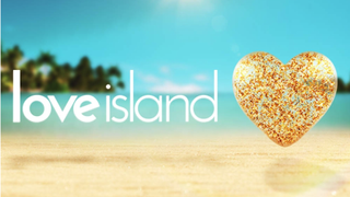 Love Island 2023 logo floating over a typical tropical sandy beach, adjacent to a giant golden heart.