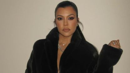 Kourtney Kardashian nailed postpartum fashion in just a coat. 