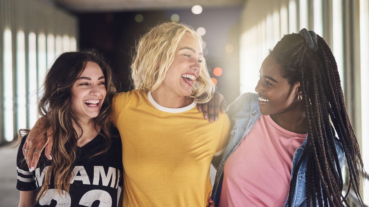 Group of college girls walking and laughing.