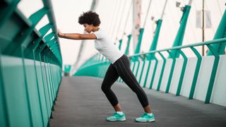 What is DOMS? Image shows person stretching on bridge