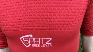 Chest section of red short-sleeved base layer