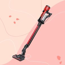 Henry Quick Corded Vacuum Cleaner on a pink background