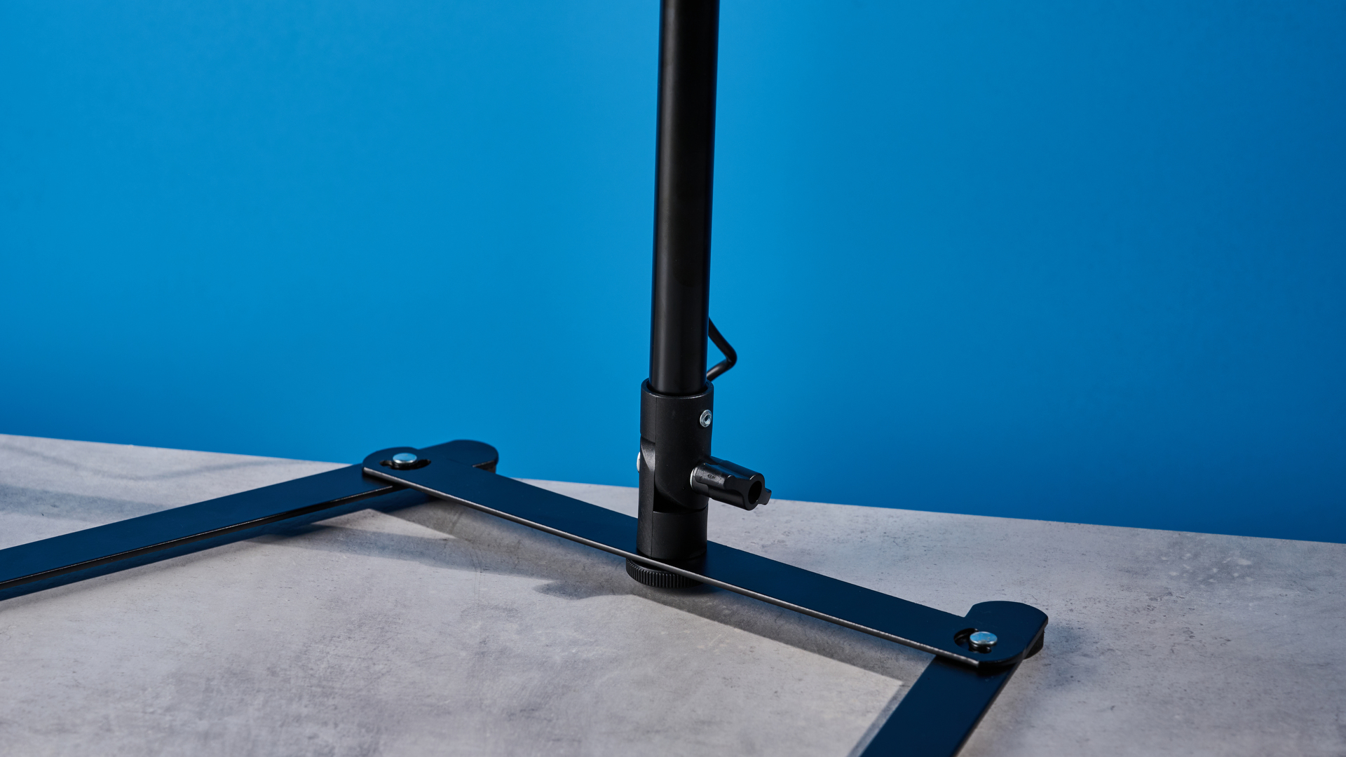 Godox 12-inch ring light photographed in front of a blue background with an iPhone on the phone mount.