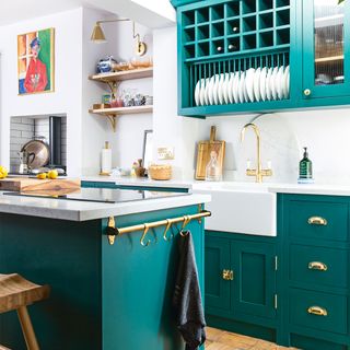 green kitchen with white worktops