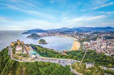 The view over La Concha bay and San Sebasti&aacute;n, with the Monte Igueldo amusement park and lookout in the foreground