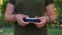 The Instax Pal 2 in a photographer's hands