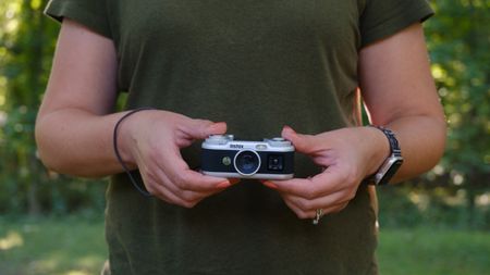 The Instax Pal 2 in a photographer's hands
