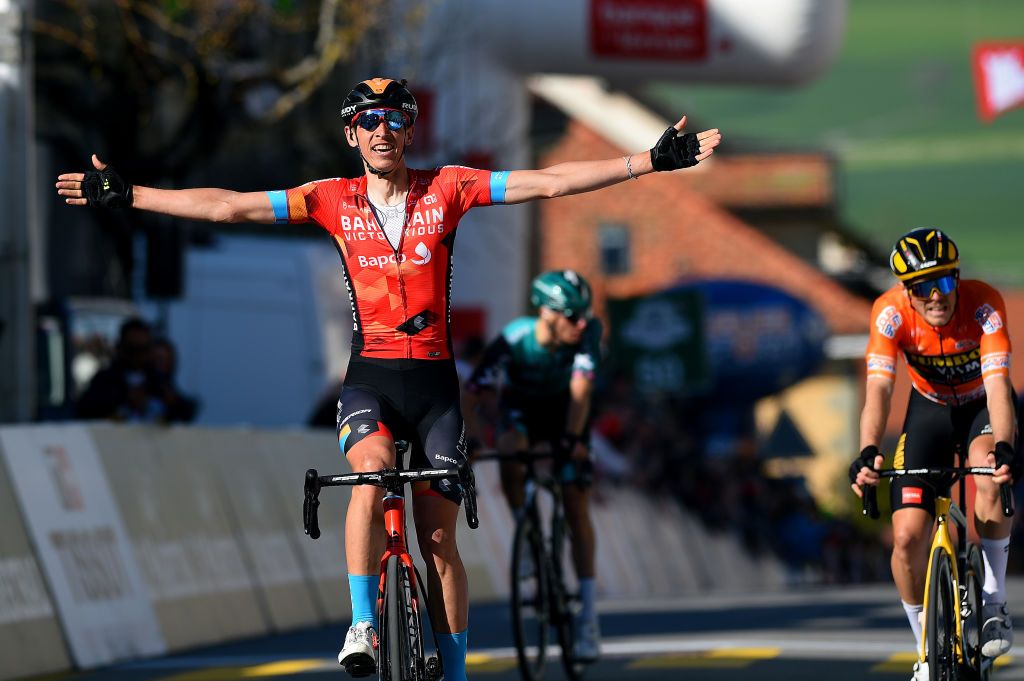 ROMONT SWITZERLAND APRIL 27 LR Dylan Teuns of Belgium and Team Bahrain Victorious celebrates winning ahead of Rohan Dennis of Australia and Team Jumbo Visma orange points jersey during the 75th Tour De Romandie 2022 Stage 1 a 178km stage from La Grande Beroche to Romont 777m TDR2022 on April 27 2022 in Romont Switzerland Photo by Dario BelingheriGetty Images