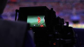 World Cup soccer through a video camera monitor