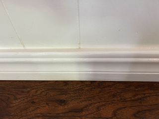 Painting baseboards in Valspar white