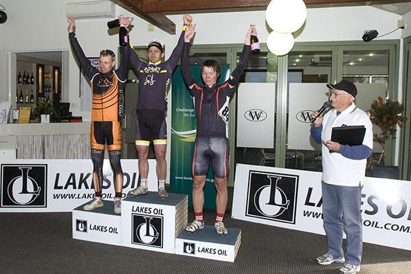 The stage three podium (l-r): Daniel McConnell (2nd,Bass Coast Shire), Rico Rogers (1st,Budget Forklifts) and Kane Walker (3rd,Apollo Bicycles) inside the Warragul Country Golf Club.