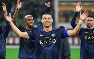 Cristiano Ronaldo and his Al-Nassr teammates celebrate beating Al-Taawoun