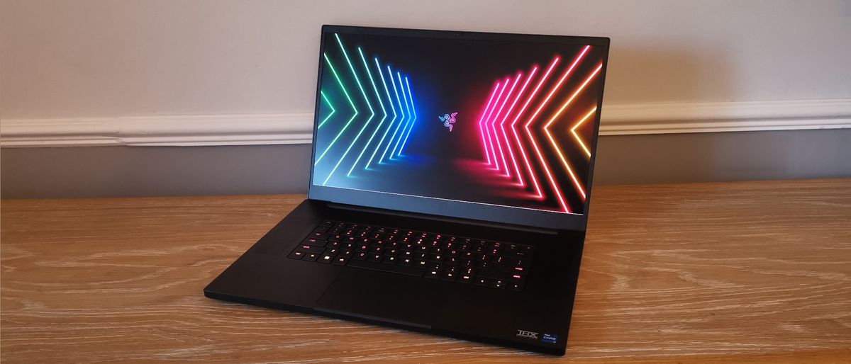 A photograph of the Razer Blade 17 (2022) on a wooden desk