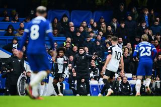 Chelsea manager Mauricio Pochettino gives instructions to his players during a Premier League match against Fulham.