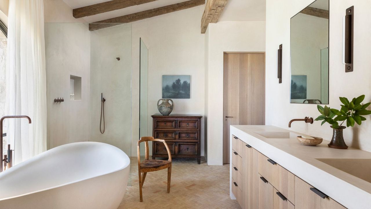 Traditional bathroom with modern vanity and freestanding bath