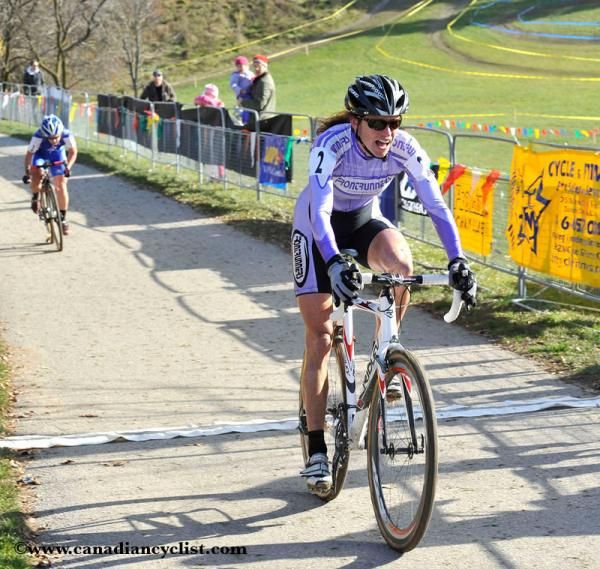 Wendy Simms sprints to the finish just one second ahead of Katy Curtis.