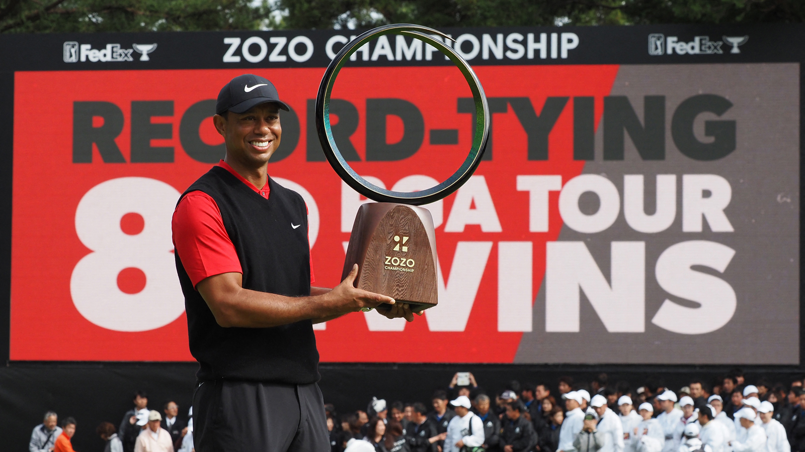 Tiger Woods holds the Zozo Championship trophy