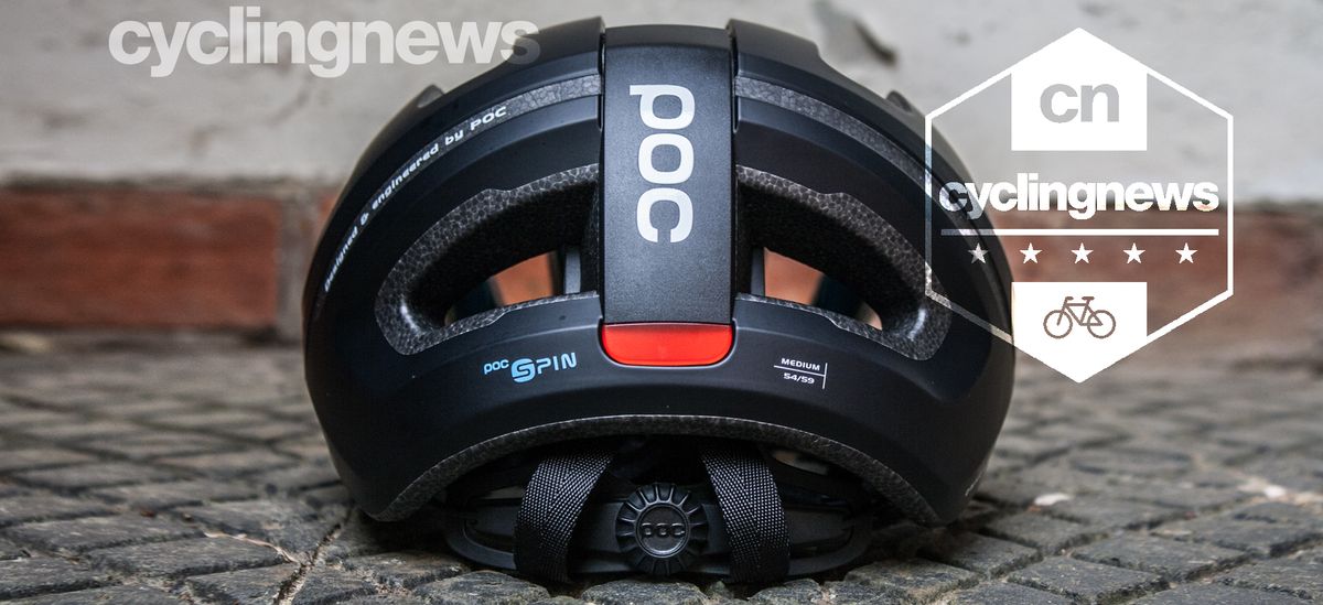 POC Omne Eternal Spin helmet resting on concrete slab