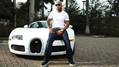 man standing in front of car