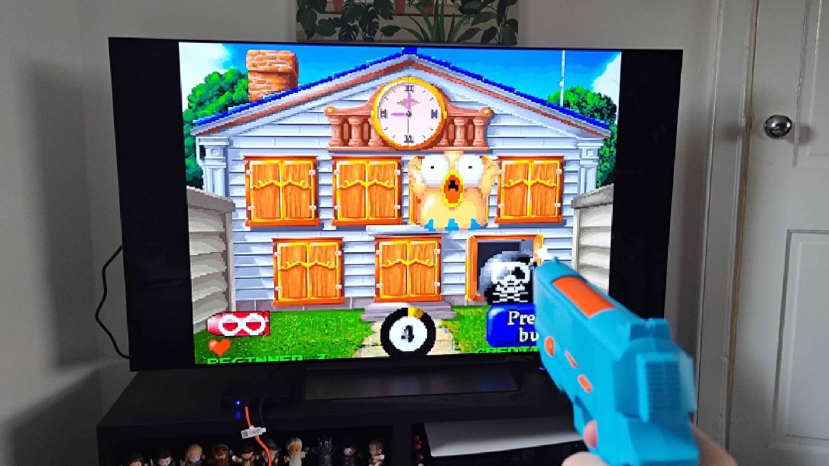 G'AIM'E Lightgun console connected to TV with Point Blank gameplay on screen