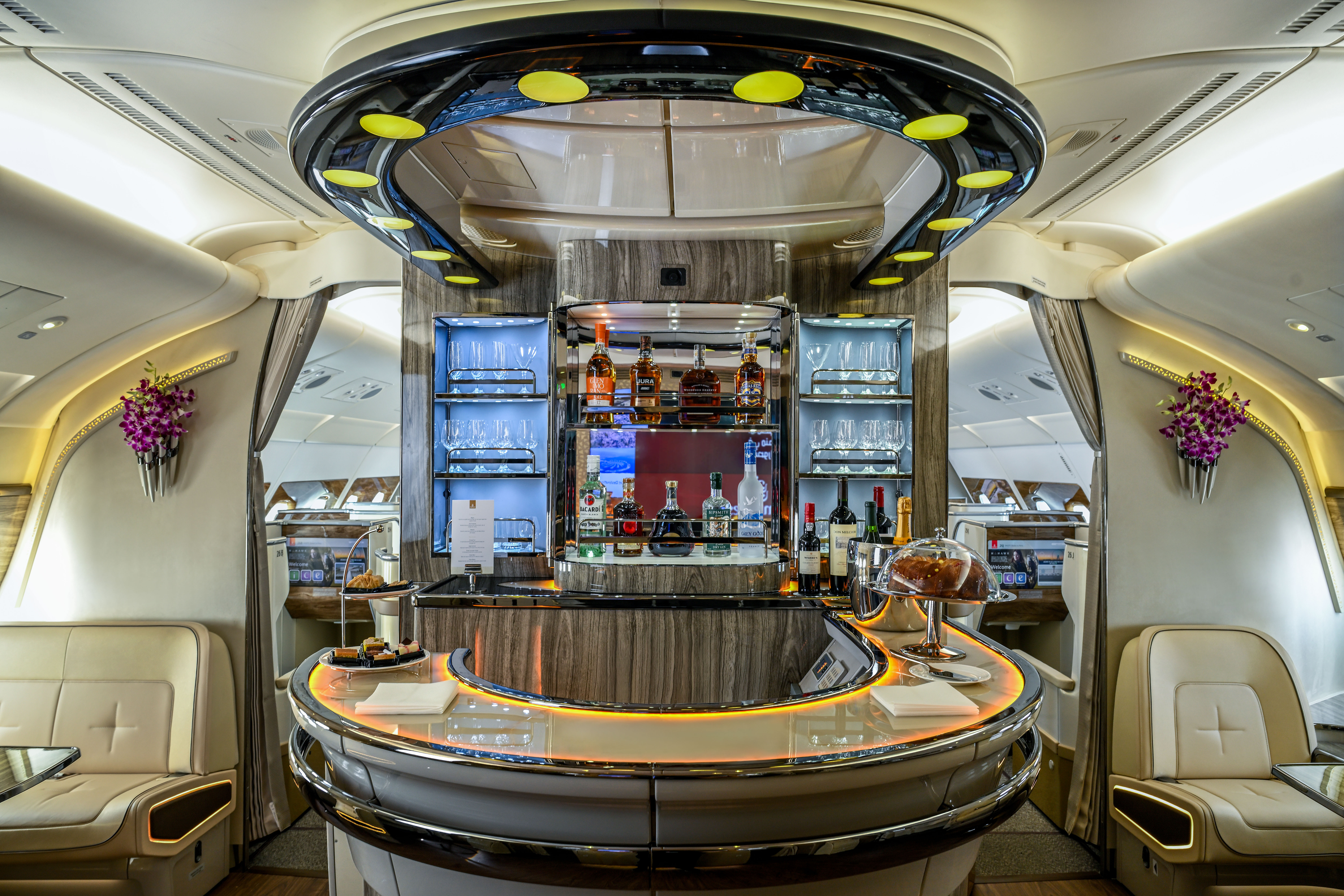 view of the interior of an aeroplane cabin featuring a beige design