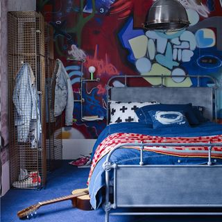 bedroom with walls papered in ripple concrete mural