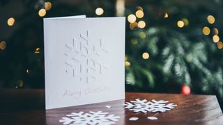 a christmas card standing up on a table