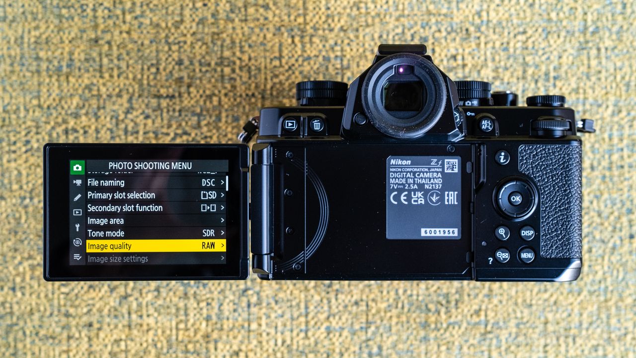 Nikon Z f camera on a vintage-style yellow chair