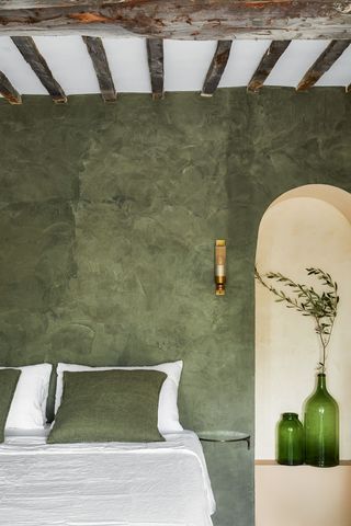 Green bedroom in 16th century French townhouse in Saint-Paul de Vence