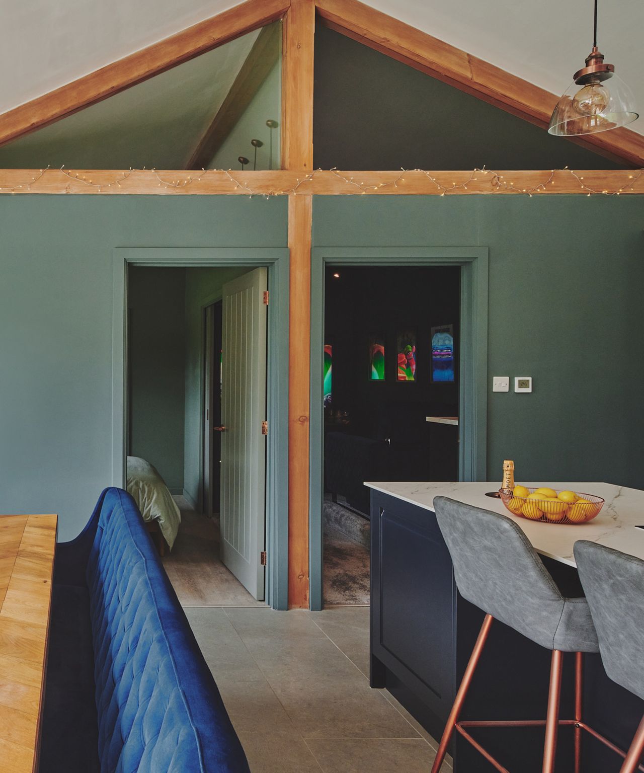 A view of a a pitched roof extension with two rooms off the main kitchen area