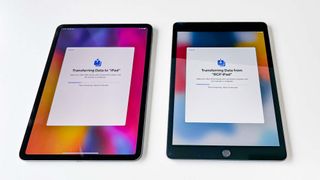Two iPads transferring data to one another