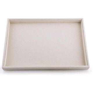 A beige jewelry organizing tray