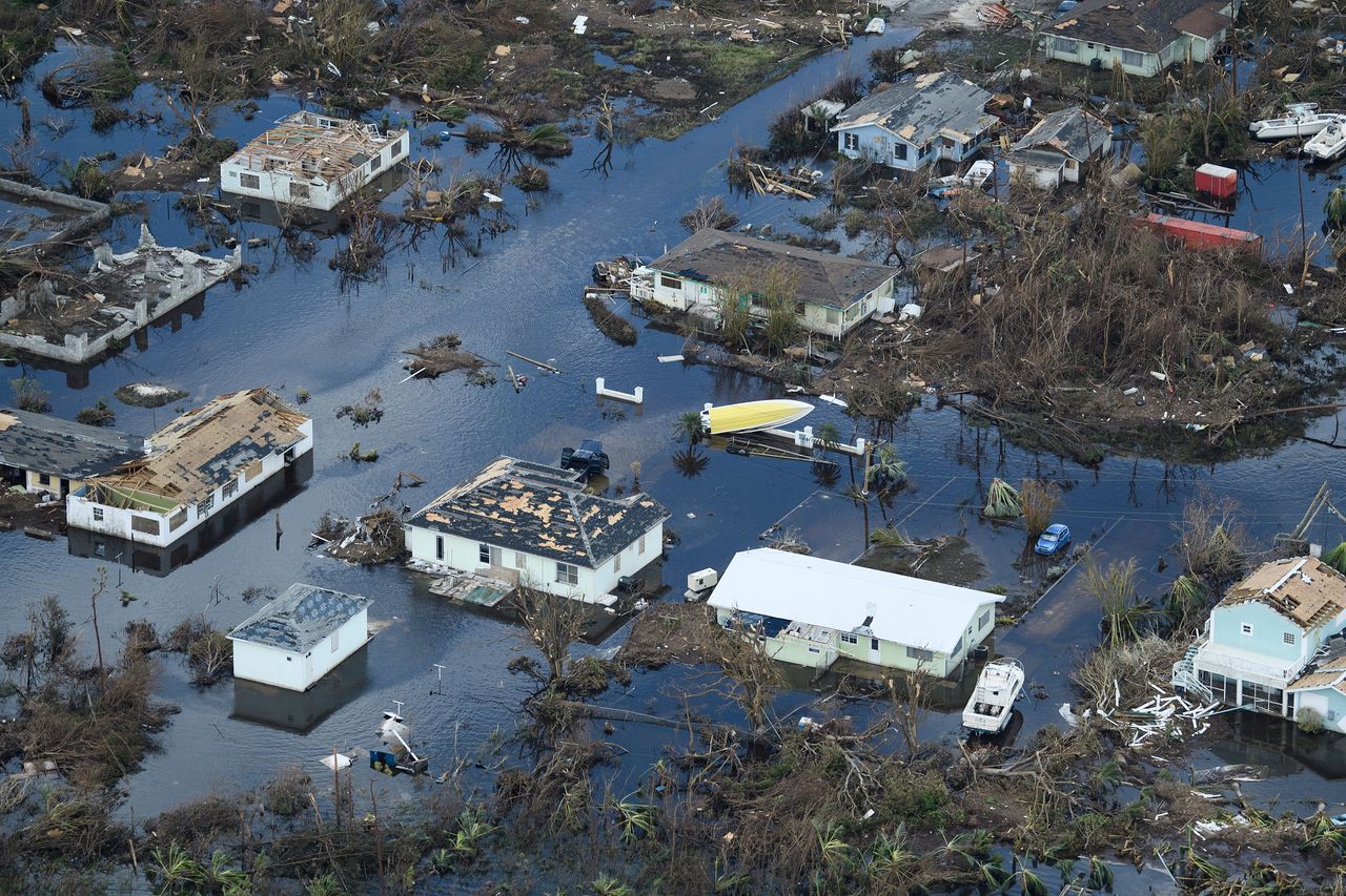 Houses poke out of the top of flood waters