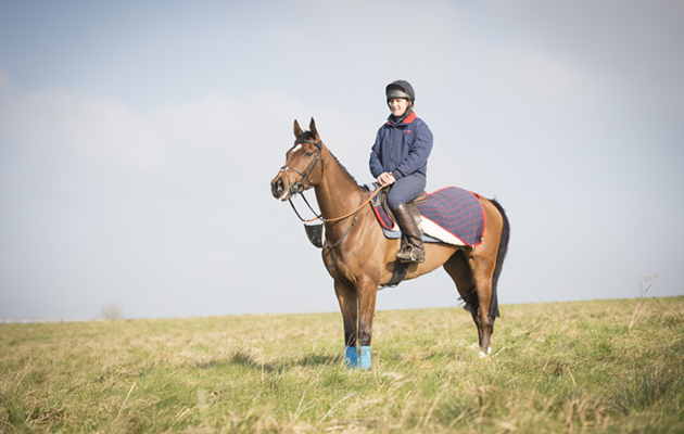 Tina riding Paddy&rsquo;s Poem on the gallops at her brother Nick Gifford&rsquo;s racing yard, which is near to her own yard