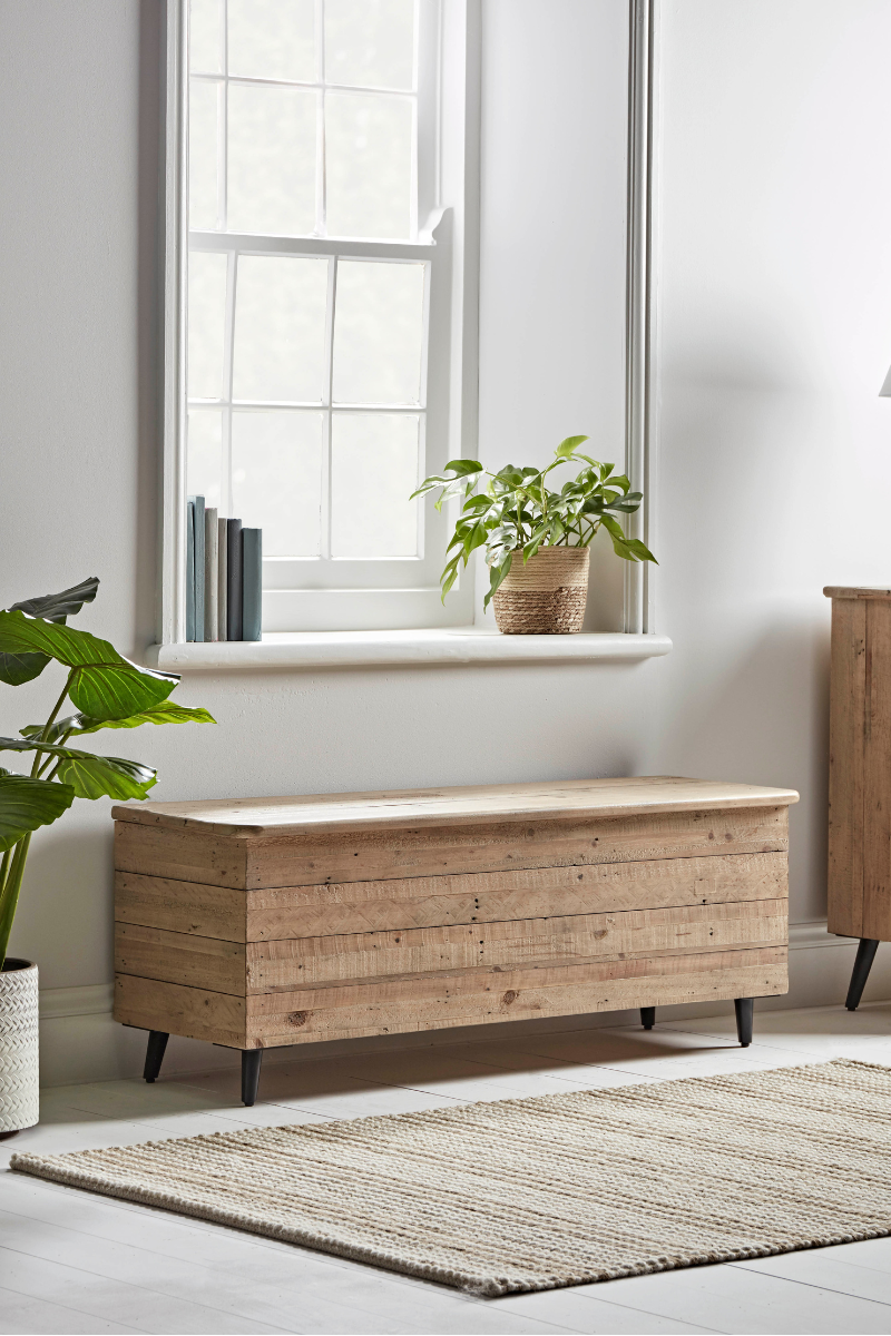 wooden storage ottoman for hallway to show how to organise a small hallway
