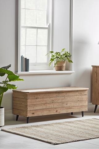 wooden storage ottoman for hallway to show how to organise a small hallway