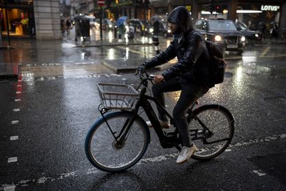 A cyclist on an e-bike in London