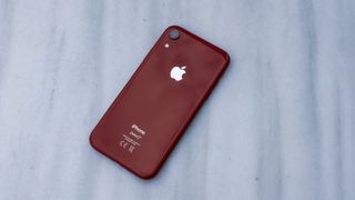 An iPhone XR from the back, in red