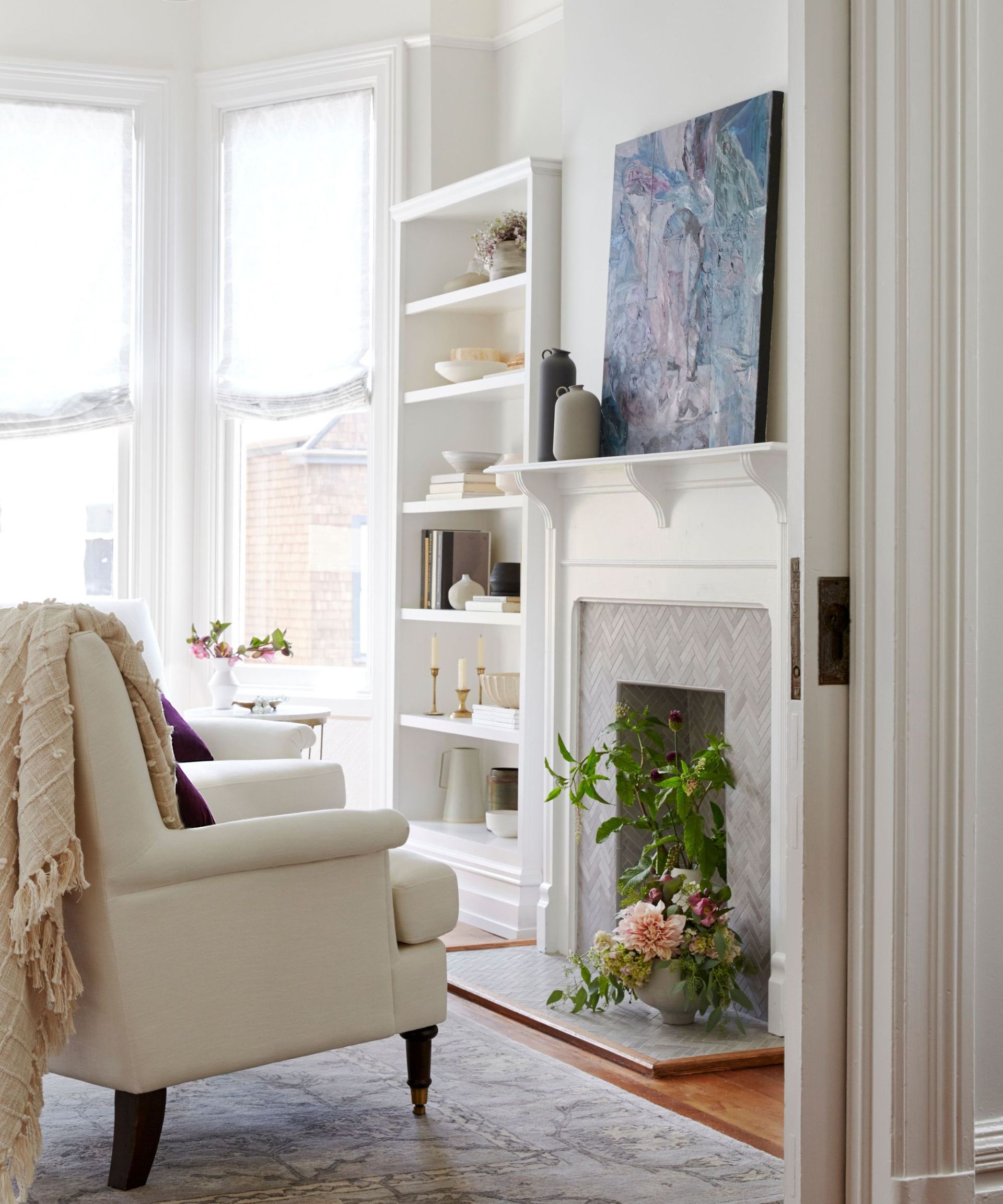 Living room with spring artwork displayed on the fireplace