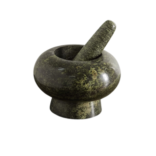 A green marble pestle and mortar