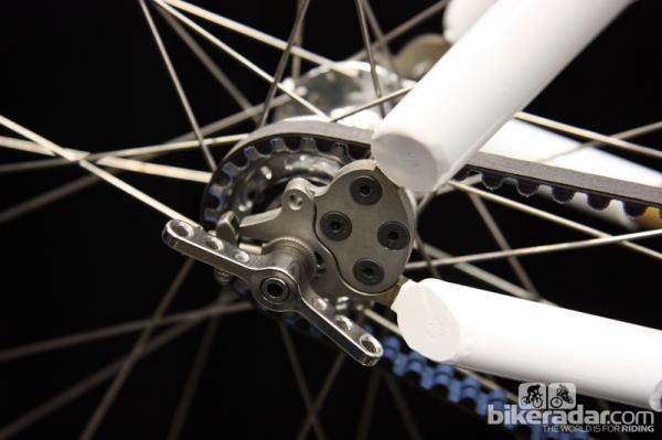 Slick wingnuts secure the rear wheel on this Panda Bicycles singlespeed. Note how the dropout is split to allow the belt to slip into the rear triangle, too.