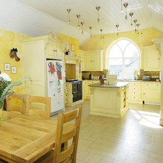 church house with wooden dining set and traditional kitchen