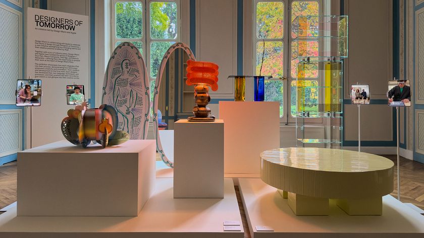 collection of objects on display at Design Miami Paris including a mirror, lamp, table and glass column