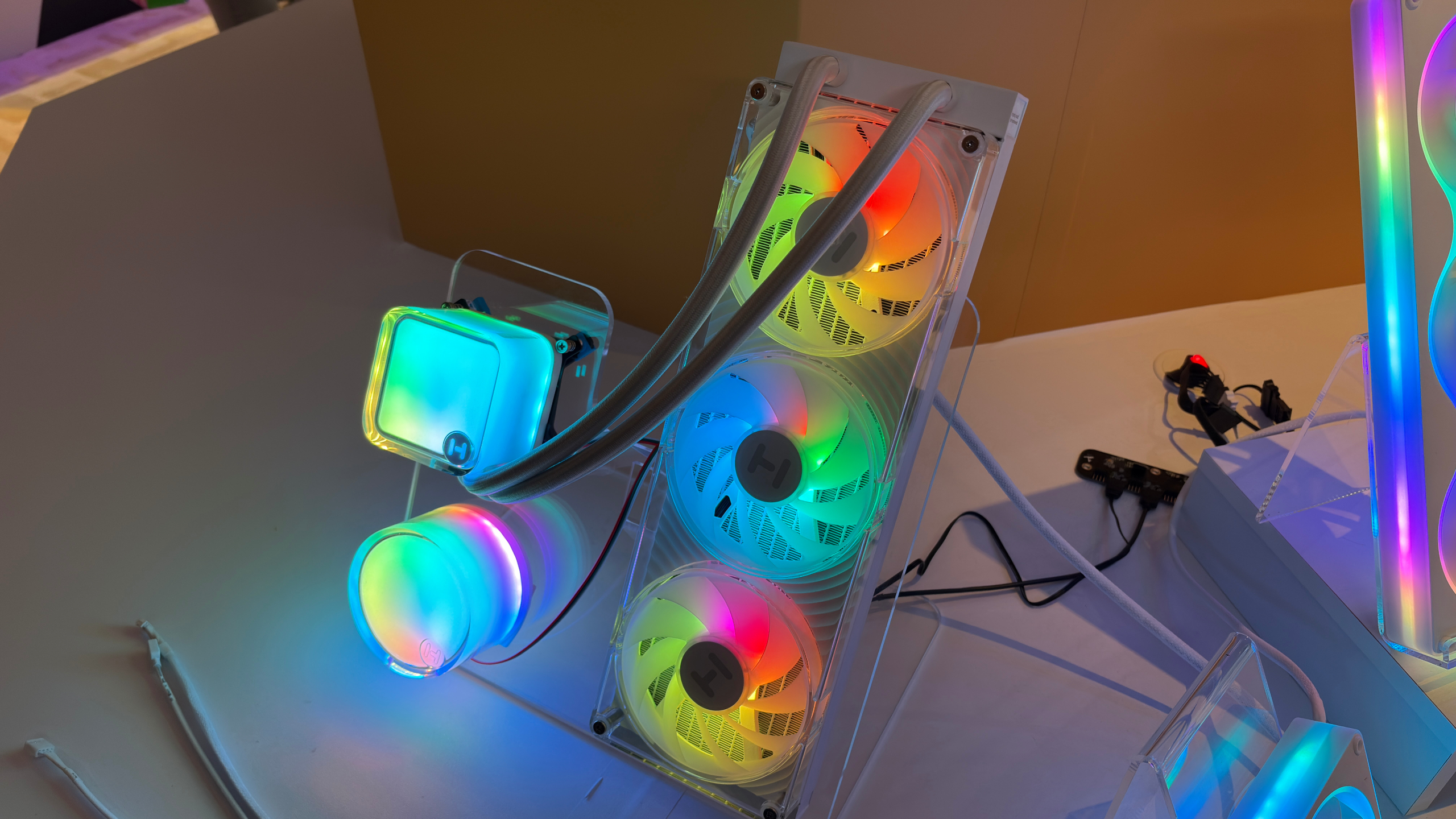 A prototype AIO cooler from Hyte that has RGB and a transparent fan shroud.