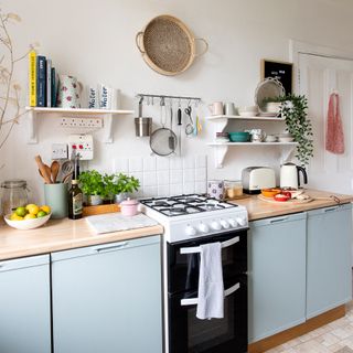 Blue kitchen with open shelving