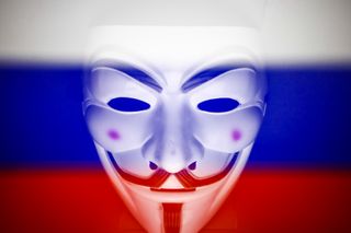 Anonymous mask placed over a Russian flag to depict hacktivism